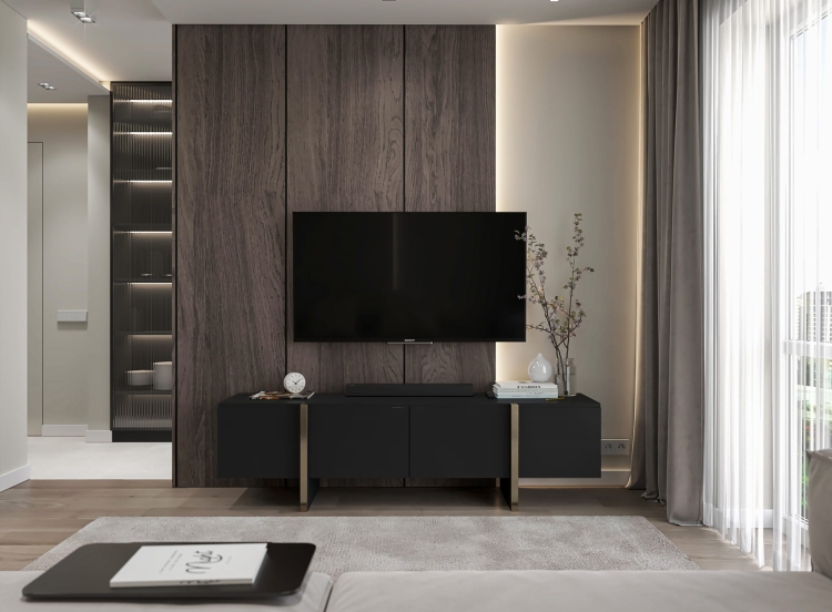 Szafka pod telewizor czarna z minimalistyczną formą i złotymi detalami.