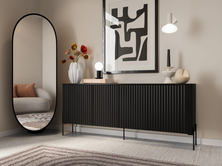 czarna komoda vera matowa z ryflowanymi frontami i zaokrąglonymi bokami na wysokich nóżkach