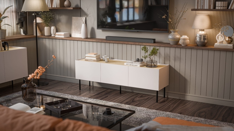 Beżowa szafka RTV na metalowych nóżkach o wysokości 20 cm.