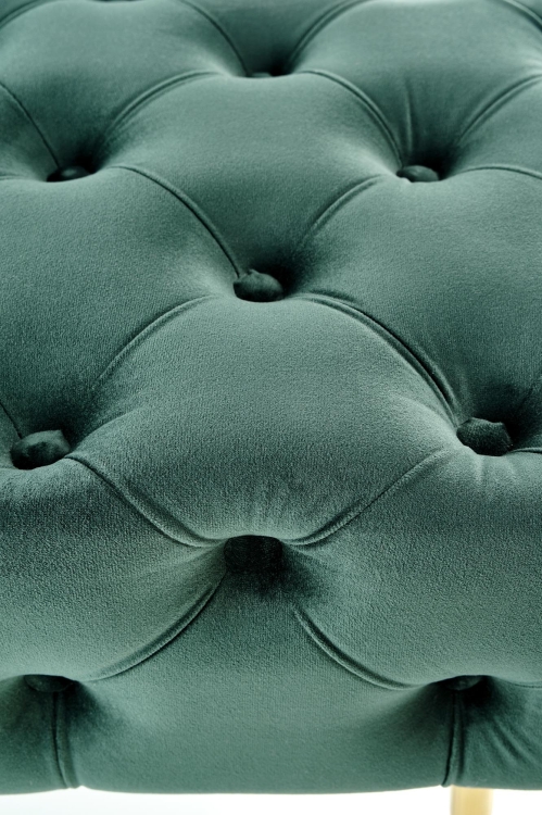 Pufa ATHENA z eleganckim pikowanym siedziskiem w stylu glamour, wykonana z miękkiej, aksamitnej tkaniny.